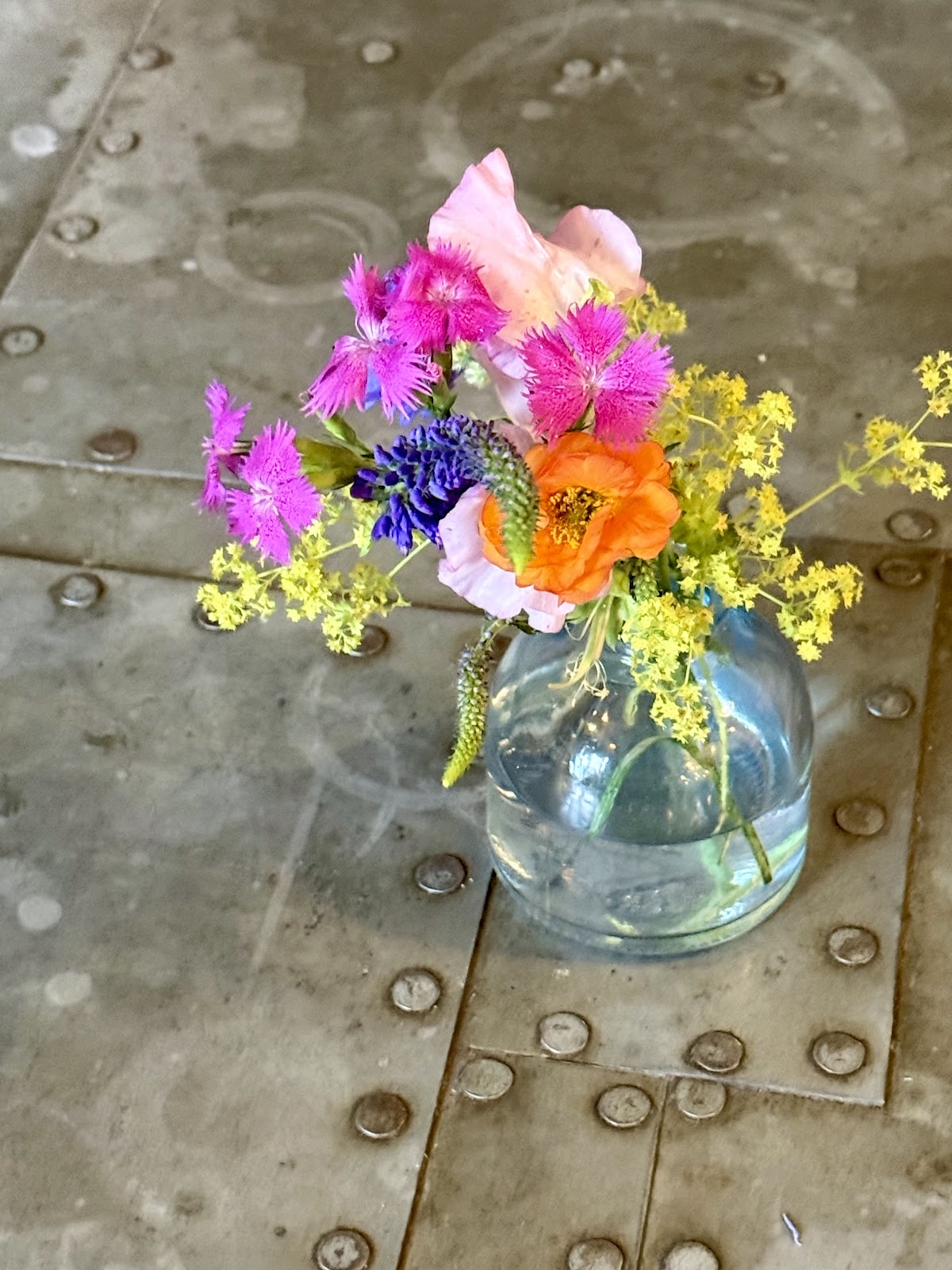 Pastel hand-tied bouquet of calla lilies, roses and carnations