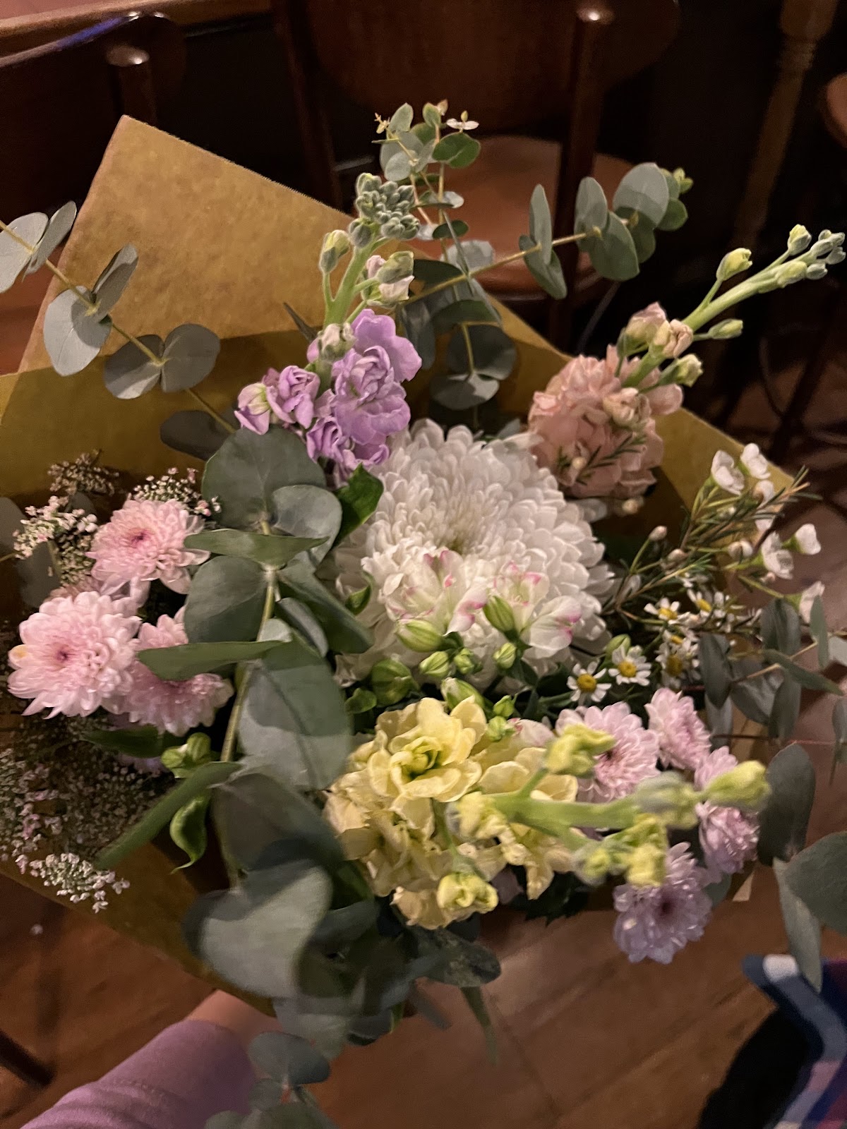 Bright mixed bouquet wrapped in orange